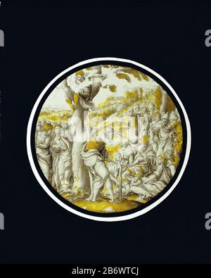 Johannes de Doper preekt in de woestijn Ruit traf Johannes de Doper predict in de woestijn Ronde gebandschilderde ruit traf voorstelling van Johannes de Doper predykend in de woestijn. Hij is afgebeeld sprekend vanaf een geïmproviseerd spreekgestoelte bestaande uit stokken, leunend tegen de sterk getordede stam van een boom. On the publiek bevinden zich tollenaars en soldaten. Hersteller : Vervaardiger: Anoniemvervaardiger: Pieter Coecke van Aelst (I) (naar)Vervaardiger: Jan Swart van Groningen (verworpen toeschrij)Plaats Herstellung: Zuidelijke Nederlanden dating: CA. 1540 Physische Kenn Stockfoto