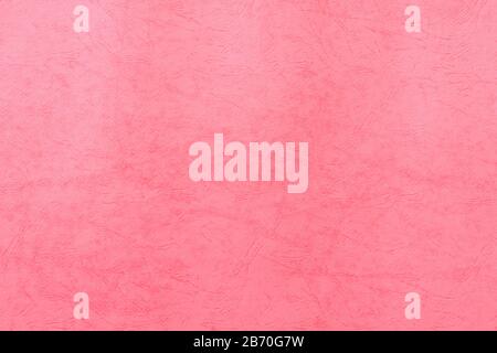 Hintergrund: Pink recyceltes Papier. Erstellen Sie einen strukturierten Papierbogens für Karten und andere Designideen. Pinke Korallen schärfen die farbige Oberfläche Stockfoto