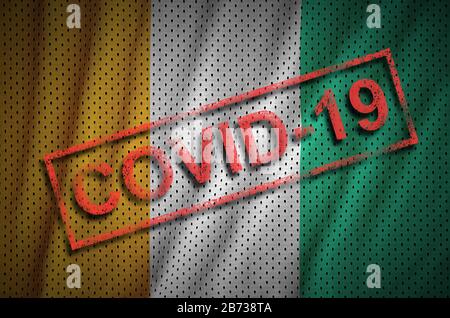 Flagge der Elfenbeinküste und roter Covid-19-Stempel. Coronavirus 2019-nCov-Outbreak-Konzept Stockfoto