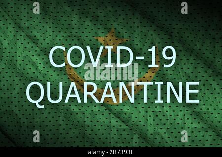 Flagge Mauretaniens und Quarantäneschrift Covid-19. Coronavirus- oder 2019-nCov-Virus-Konzept Stockfoto