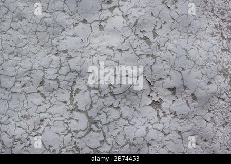 Alte, bemalte Wand mit grauen Farbteilen. Nahtlose Textur. Wird als Hintergrund verwendet. Kopieren Sie Speicherplatz für Ihren Text. Stockfoto