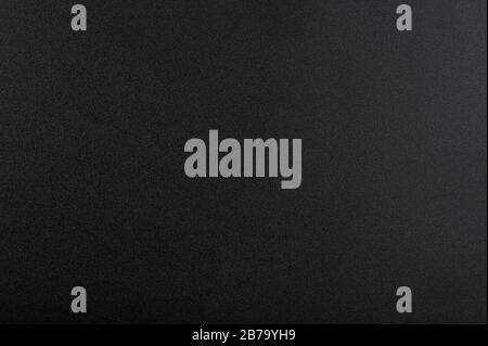 Abstrakter dunkler Hintergrund. Schwarze Struktur mit mattem Muster Stockfoto
