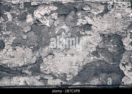 Verwitterte, gerissene Wand, grungiger Wandtextur Hintergrund Stockfoto