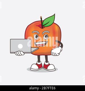 Ein Bild von Honeycrisp Apple Zeichentrick-Maskottchen, das mit einem Laptop arbeitet Stockfoto