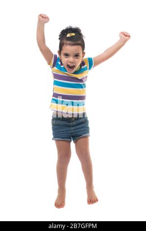 Happy Excited Girl Jumping in The Air Isoliert auf weißem Hintergrund Stockfoto