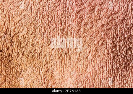 Flache Struktur aus hellbraunem Material in der Nähe. Stockfoto