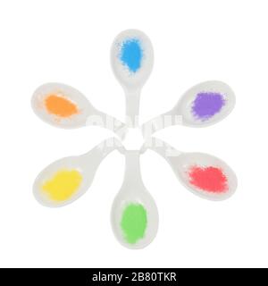 Porzellan, Keramiklöffel und bunte Gewürze. Stockfoto