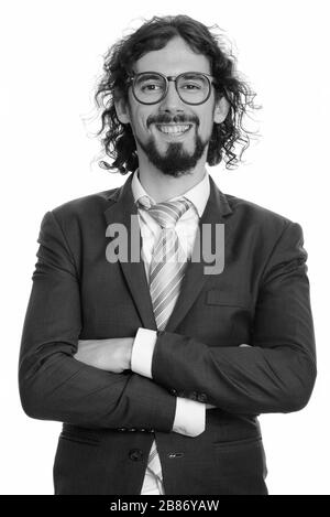 Porträt eines fröhlichen, gutaussehenden bärtigen Geschäftsmannes im Anzug lächelnd Stockfoto