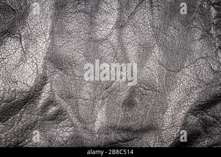 Zerknitterte schwarze Leder Textur Hintergrund. Abstrakte Textur aus Leder. Stockfoto