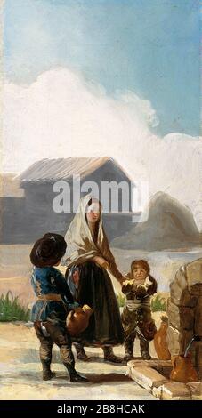 Mujer y dos niños junto a una fuente. Stockfoto