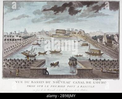 Blick auf das Becken des neuen Ourcq-Kanals auf der ersten Wiegebrücke gegenüber der Rotunde und der Barriere la Villette Chapuy et Toussaint. "Vue du bassin du nouveau Canal de l'Ourcq, pry sur le Premier pont à bascule". Lithographie coloriée. Paris, musée Carnavalet. Stockfoto