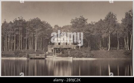 Chalet des Iles auf der großen Insel, des Bois de Boulogne, 16. Bezirk Chalet des Iles sur la grande île, des boulogne, 16. Bezirk, 16. ème. Tirage sur Papier albuminé à partir d'un négatif sur verre au collodion humide. 1858-1862. Photographie de Charles Marville (13-1879). Paris, musée Carnavalet. Stockfoto