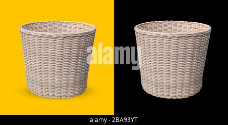 Cane Wicker Basket isoliert auf gelbem und schwarzem Hintergrund Stockfoto