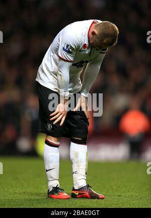 Wayne Rooney von Manchester United kämpft, nachdem er eine Verletzung erlitten hat Stockfoto