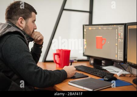 Grafikdesigner und 3D-Programmanimator arbeiten am Computer im Büro Stockfoto