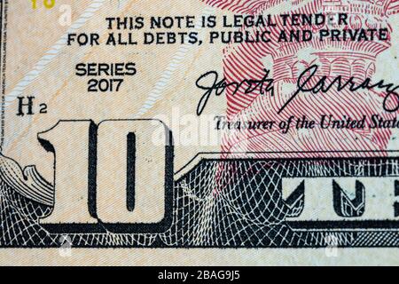 Nahaufnahme der Makrodetails von Geldscheinen in US-Dollar, Detailfoto von US-Dollar. Weltgeldkonzept, Inflation und Sparkonzept Stockfoto