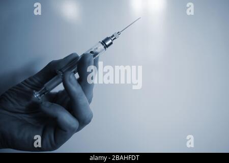Spritze in der hand Stockfoto
