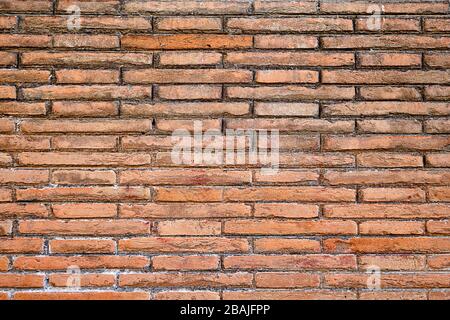 Hintergrund aus einer abgenutzten roten Ziegelwand Stockfoto
