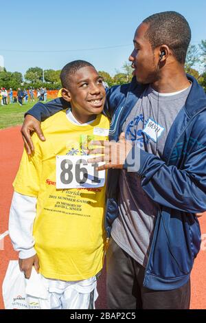 Miami Florida, Liberty City, Traz Powell Stadium, Special Olympics, Bedürfnisse, Track & Field geistig Behinderte spezielle Bedürfnisse, eingeschränkt, Freiwilliger V Stockfoto