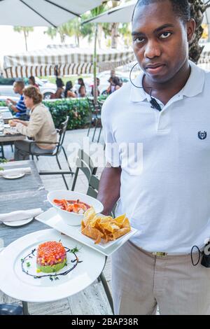 Miami Beach, Florida, Ocean Drive, The Tides South Beach, Hotel, La Marea, Restaurant, Restaurants, Restaurants, Restaurants, Cafés, Schwarze Männer, Erwachsene, wai Stockfoto