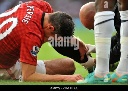 Robin van Persie von Manchester United spürt sein verletztes Bein Stockfoto