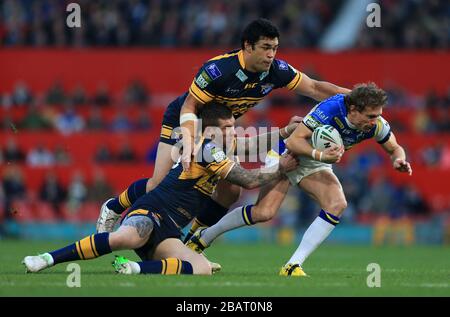 Warrington Wolves Brett Hodgson und Leeds Rhinos' Kylie Leuluai und Brett Delaney Stockfoto