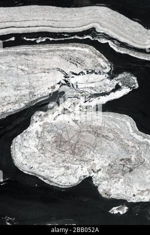 Abstrakte natürliche Struktur aus schwarzem und weißem Granit. Stockfoto