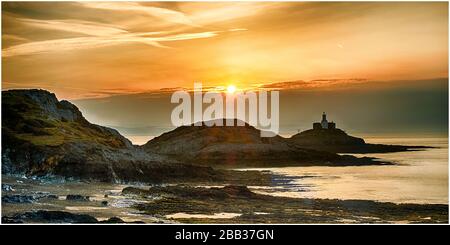 Mumbles Kopf, während die Sonne aufgeht Stockfoto