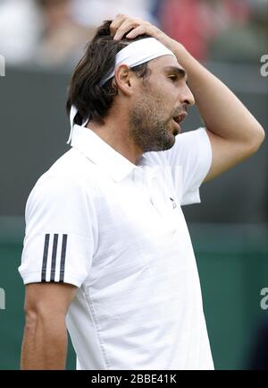 Zyperns Marcos Baghdatis hat im ersten Tag der Wimbledon Meisterschaften im All England Lawn Tennis and Croquet Club in Wimbledon gegen den Kroatien-Maran Cilic degramiert. Stockfoto