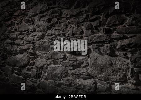 Textur einer Steinwand. Hintergrund der Wandstruktur aus altem Burgstein Stockfoto