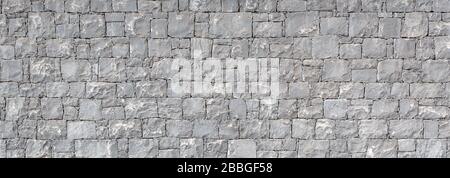 Unregelmäßige Natursteinwand (strukturierter Hintergrund) Stockfoto
