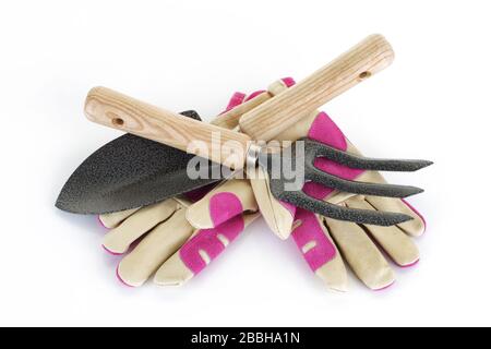 Gartengabel und Handschuhe auf weiß Stockfoto