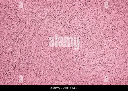 Textur aus rosafarbenem Stuck. Einfacher Hintergrund für das Design. Nahaufnahme. Stockfoto
