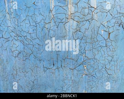 Peeling-Lack auf der Wand nahtlose Textur. Muster aus rustikalem blauem Grunge. Gesprungene blaue Farbe. Stockfoto