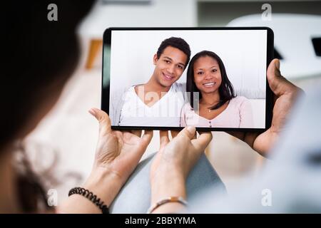 High Angle View Of Young Couple Using Digital Tablet Together At Home Stockfoto