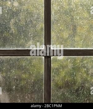 Bedrahtete Fenster mit verschwommenem Hintergrund, die im Morgenlicht zu sehen sind. Stockfoto