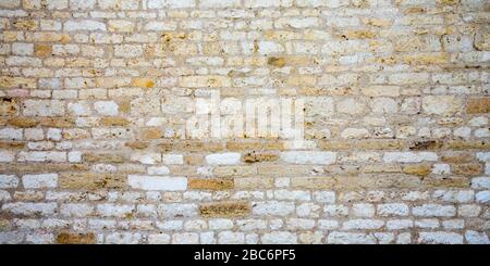 Gestapelte Steinwand Textur Mittelalter Hintergrund aus Steinmauer Mauerwerk Stockfoto