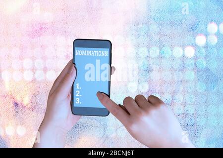 Schreiben Hinweis Nominierungen angezeigt. Business Konzept für Maßnahmen der Ernennung oder für Preis nominiert werden Stockfoto