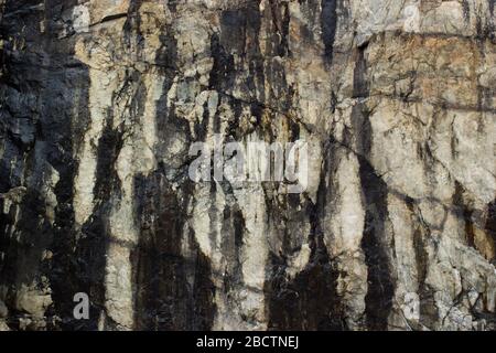 Natürlich schmutziger rustikaler Stein, die Textur von Steinmauerkorrosion oder Grunge Stein Textur Hintergrund Stockfoto