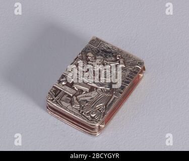 Versuchung des heiligen Anthony. Forschung in ProgressRectangular, erhöhte Dekoration, mit Szene der Tempatation von St. Anthony. Er kniet an Holztisch und -Bank, in den Gewändern des Mönch, vor dem offenen Gebetbuch, mit Schädel und Kruzifix in den Händen. Versuchung des heiligen Anthony Stockfoto