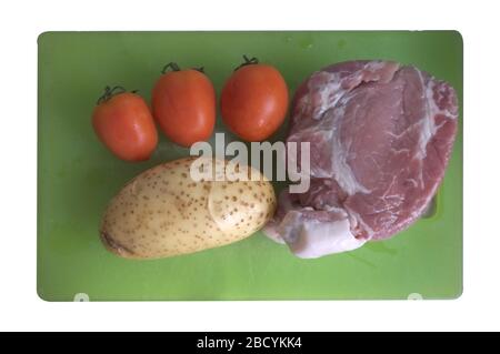 Schweineküche: Schweinefleisch, Tomate, Kartoffel Stockfoto