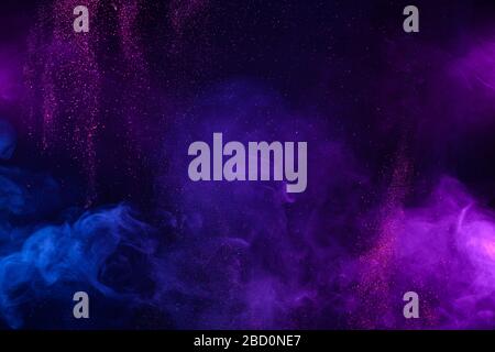 Smoke colorful clouds and shiny glitter bursts. Abstract outer space fairy tale background. Stockfoto