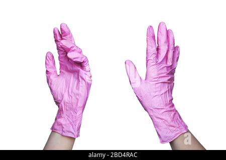 Zwei weibliche Hände in pinkfarbenen medizinischen Gummihandschuhen auf weißem Hintergrund isoliert Nahaufnahme, Arzt oder Pflegefhände in Latex-Schutzhandschuhen, Einweg Stockfoto
