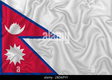 Flagge des Landes der Demokratischen Republik Nepal auf welligem Seidentextilien im Hintergrund. Stockfoto