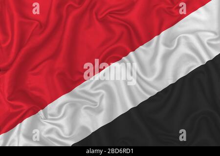 Flagge des Fürstbistums Sealand auf welligem Seidentextiliengewebe. Stockfoto