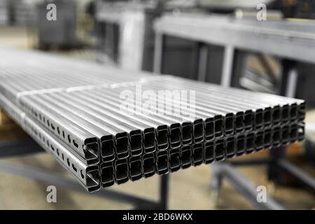 Bent metal profile channel. Zinc steel profile at bundle. Stockfoto