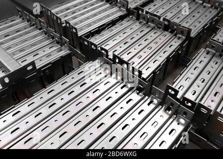 Bent metal profile channel. Zinc steel profile at bundle. Stockfoto