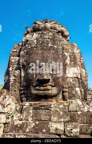 Buddha-Gesicht in Stein gehauen am Bayon-Tempel, Angkor Thom, Angkor, UNESCO, Kambodscha, Indochina, Südost-Asien, Asien. Stockfoto