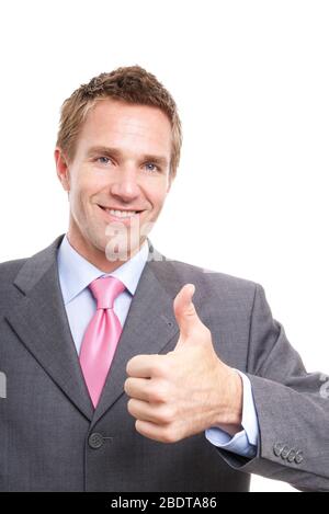 Fröhlicher Geschäftsmann, der einen lächelnden Daumen hoch vor weißem Hintergrund Stockfoto