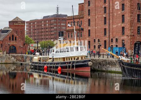 The Daniel Adamson (The Danny) ein restaurierter Dampfschlepper während eines Besuchs an der Küste von Liverpool, der neben dem Merseyside Maritime Museum festgemacht wurde Stockfoto